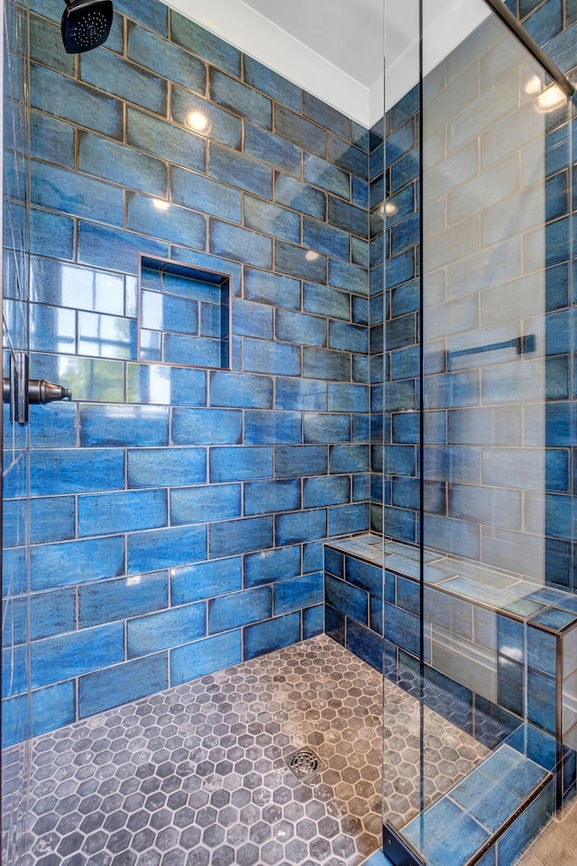 bathroom featuring tiled shower