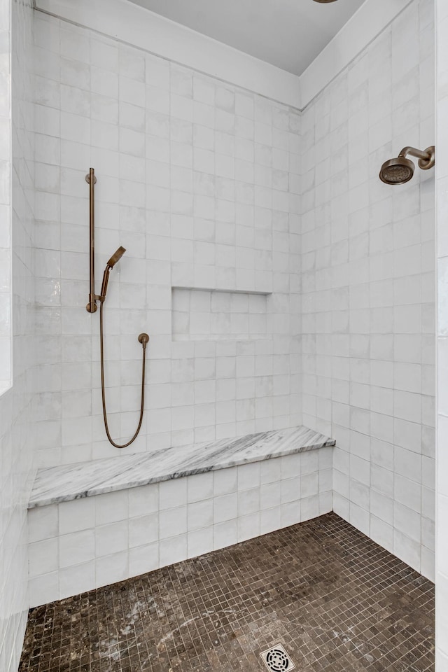 bathroom featuring tiled shower