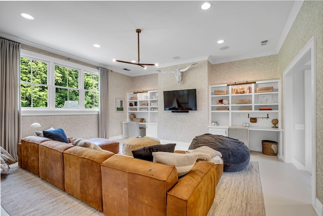 living room featuring a chandelier and ornamental molding