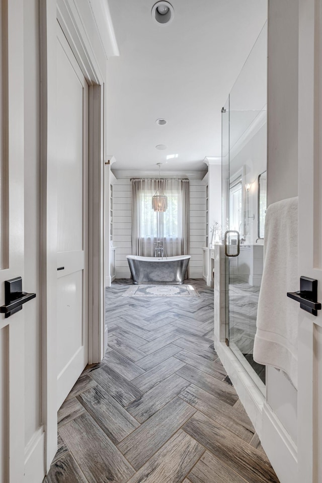 bathroom with plus walk in shower and ornamental molding