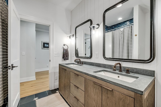 bathroom with tile patterned floors, curtained shower, and vanity