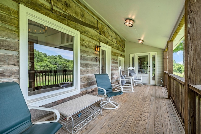 wooden terrace with a porch