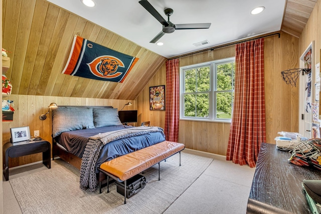 bedroom featuring carpet flooring, ceiling fan, wood walls, and lofted ceiling