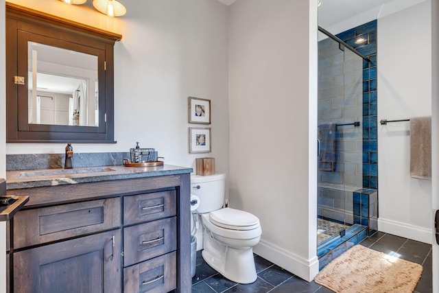 bathroom with toilet, vanity, tile patterned floors, and a shower with shower door