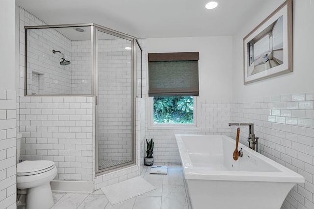 bathroom featuring toilet, tile walls, and shower with separate bathtub