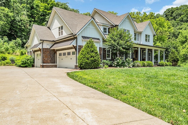 view of front facade featuring a front yard and a garage