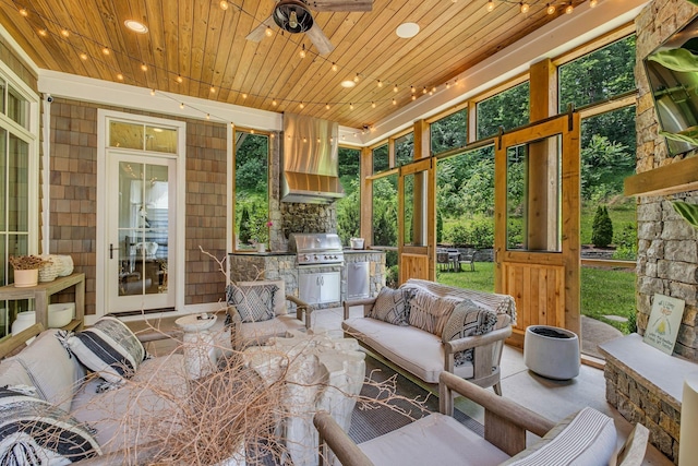 sunroom / solarium with ceiling fan and wooden ceiling