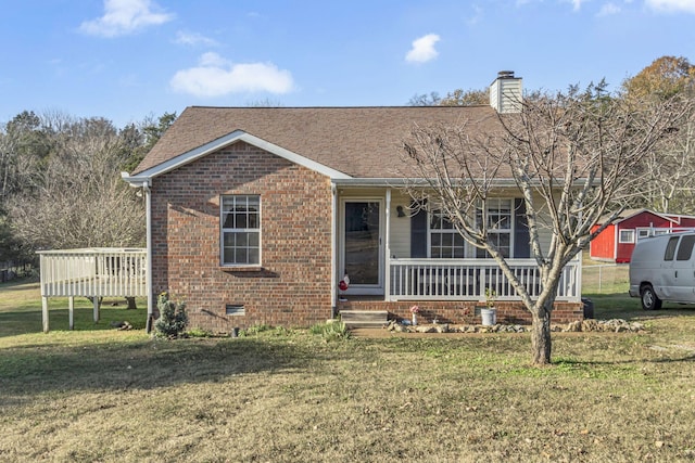 view of front of house featuring a front yard and a deck