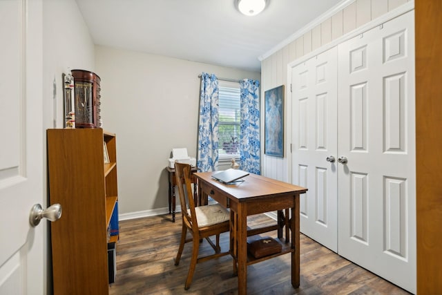 home office with dark hardwood / wood-style flooring and ornamental molding