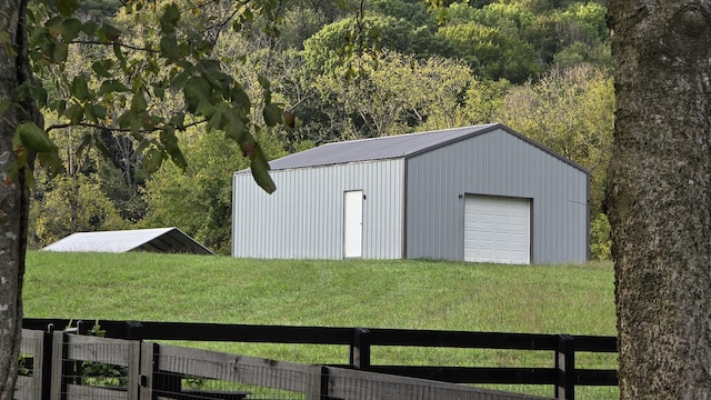 view of outbuilding featuring a yard and a garage