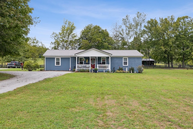 ranch-style home with a porch and a front lawn