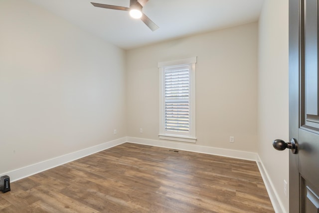 unfurnished room featuring ceiling fan and wood-type flooring