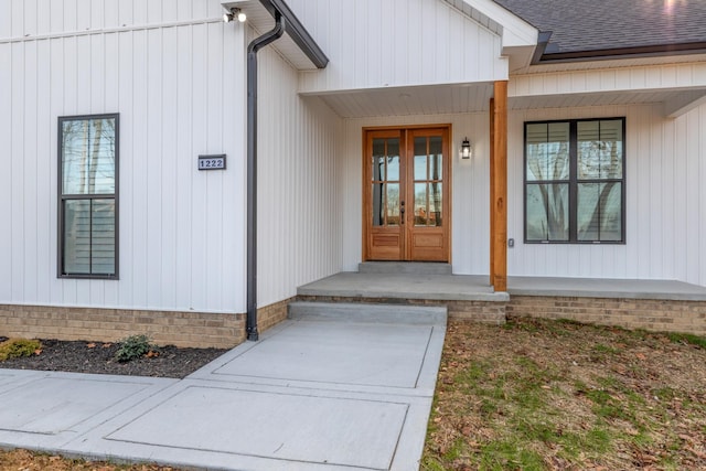 doorway to property featuring french doors and a porch