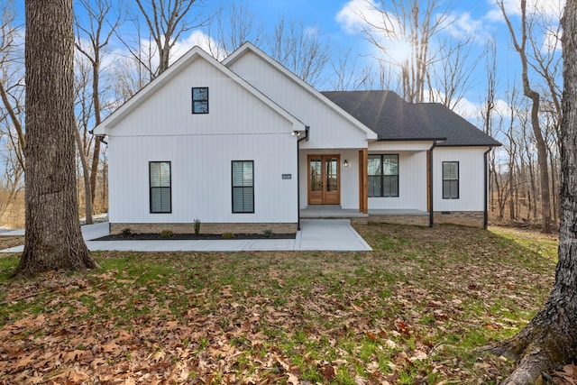 rear view of house with a yard