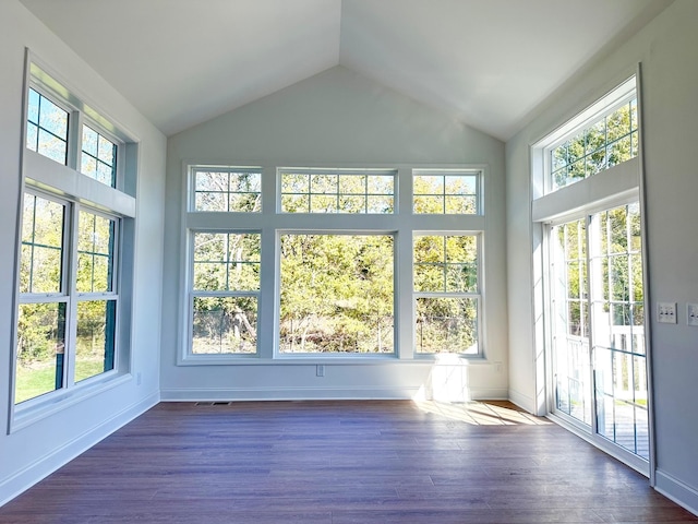 unfurnished sunroom featuring vaulted ceiling