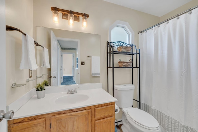 bathroom featuring vanity, a baseboard radiator, and toilet