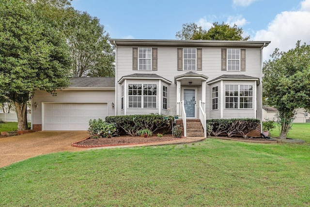 view of front of house with a garage and a front lawn