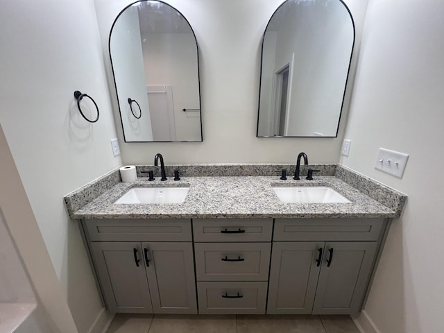 bathroom featuring tile patterned floors and vanity