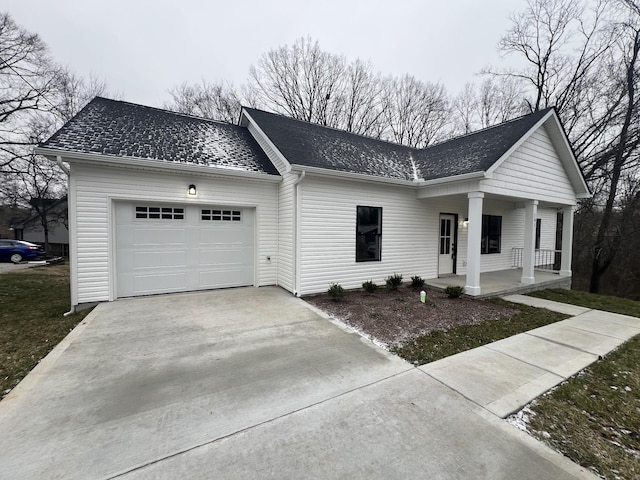 view of front of house featuring a garage and covered porch