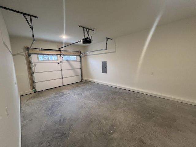 garage with electric panel and a garage door opener