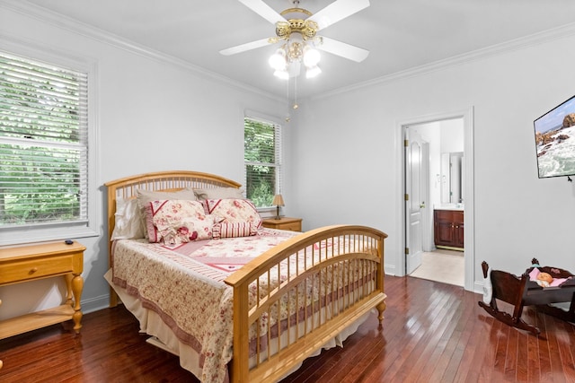 bedroom with dark hardwood / wood-style floors, ensuite bath, ceiling fan, and ornamental molding