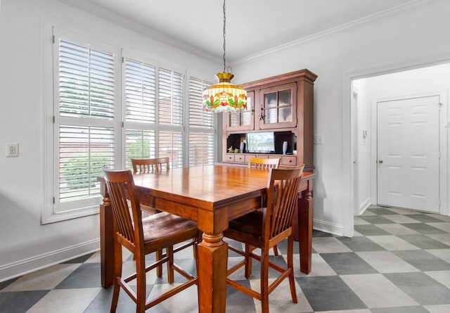 dining space with a chandelier and ornamental molding