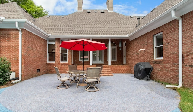 view of patio with area for grilling and french doors