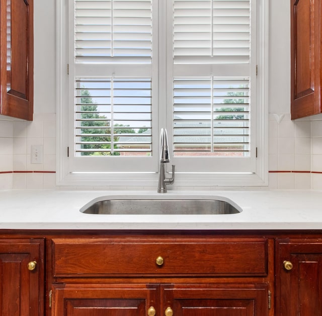 kitchen with decorative backsplash and sink