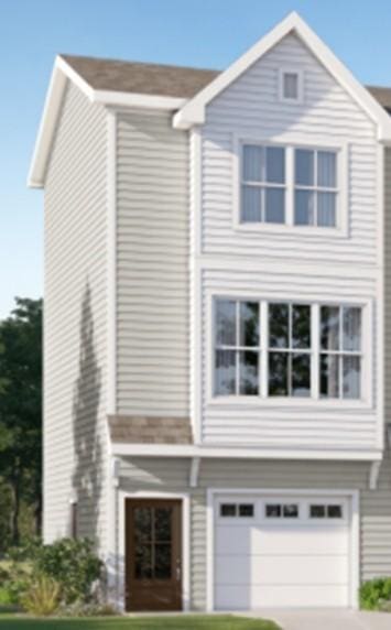 view of front facade with a front lawn and a garage