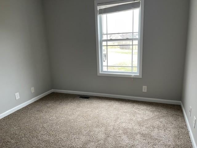 unfurnished room featuring carpet floors