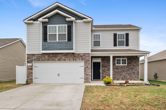 craftsman house featuring a garage and a front lawn