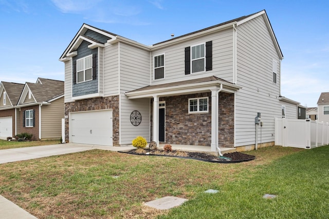 view of front of property featuring a garage and a front yard