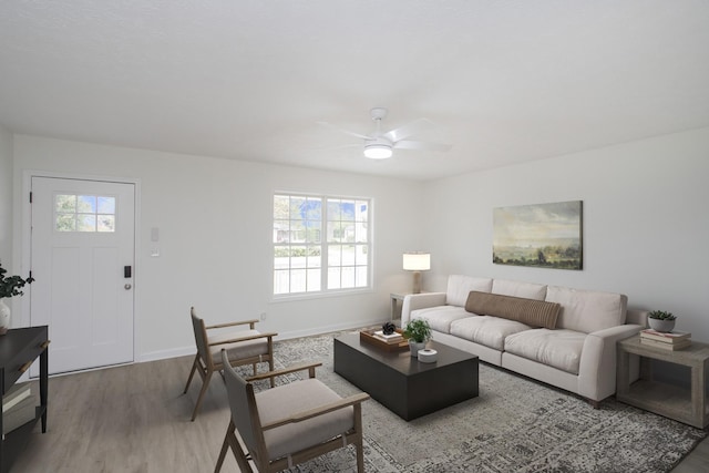 living room with hardwood / wood-style floors and ceiling fan