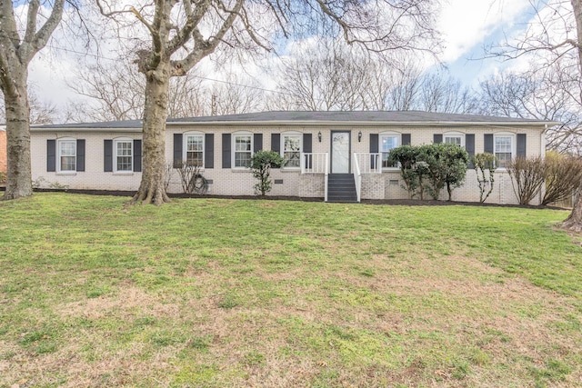 single story home featuring a front lawn