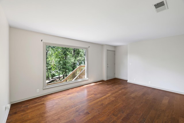 empty room featuring dark wood-type flooring