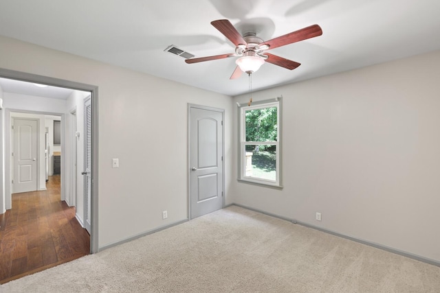 unfurnished bedroom with carpet and ceiling fan