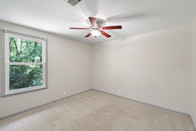 unfurnished room with carpet flooring and ceiling fan