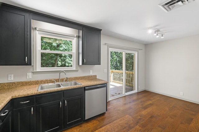 kitchen with dishwasher, dark hardwood / wood-style flooring, and sink