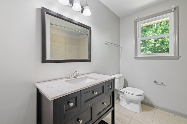 bathroom with tile patterned floors, vanity, and toilet