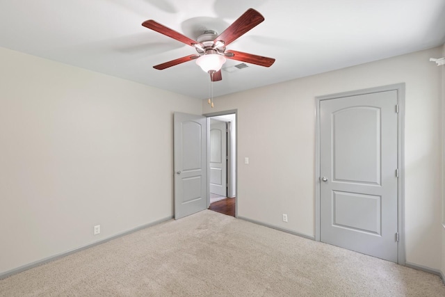 unfurnished bedroom with carpet flooring and ceiling fan