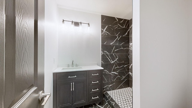 bathroom featuring vanity and a tile shower