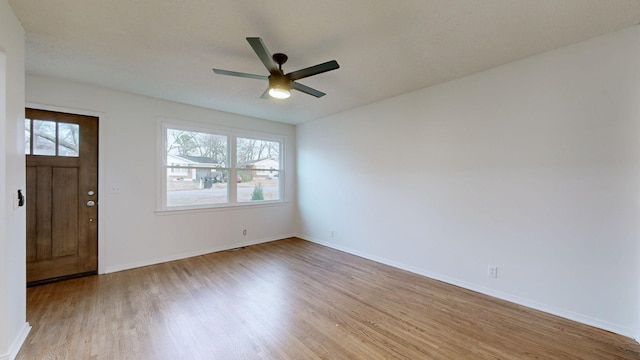 entryway featuring ceiling fan, light hardwood / wood-style floors, and a healthy amount of sunlight