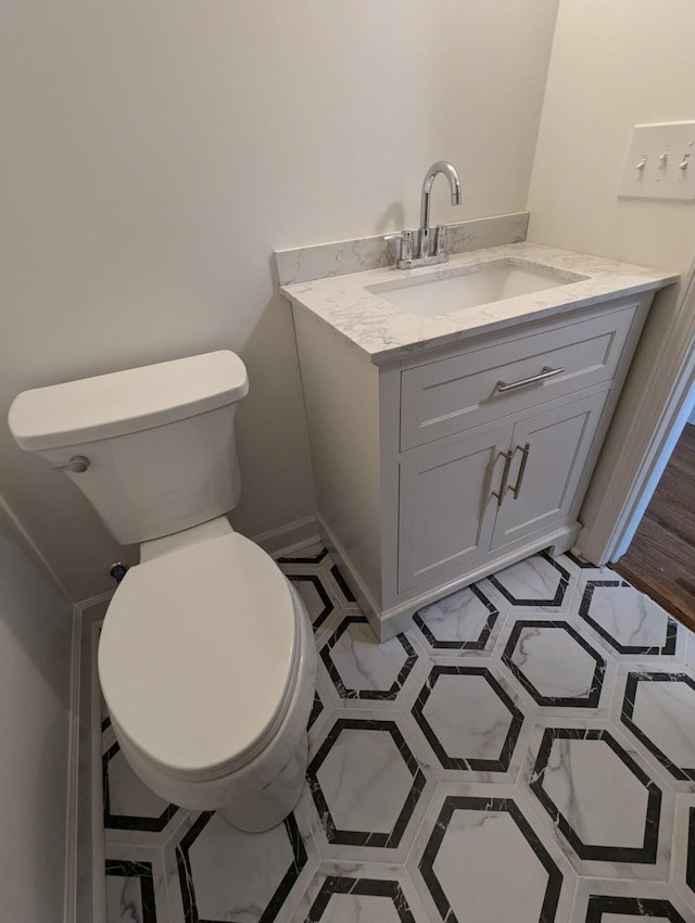 bathroom with vanity and toilet