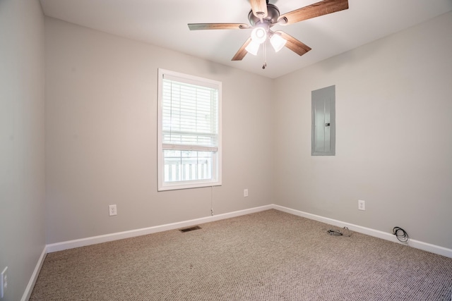 carpeted empty room featuring electric panel and ceiling fan