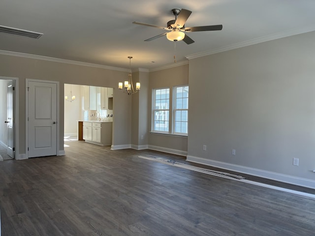 unfurnished dining area with dark wood-style floors, visible vents, crown molding, and a sink