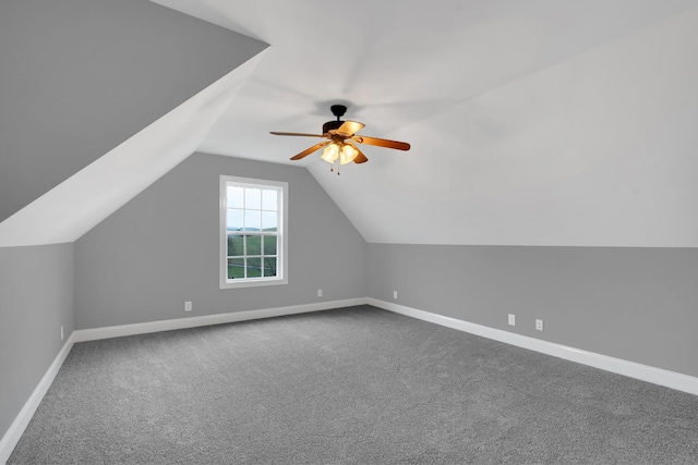 bonus room with carpet floors, ceiling fan, and lofted ceiling