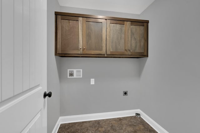 washroom featuring hookup for an electric dryer, hookup for a washing machine, and cabinets