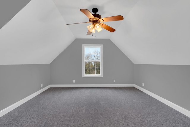 bonus room with carpet flooring, vaulted ceiling, and ceiling fan