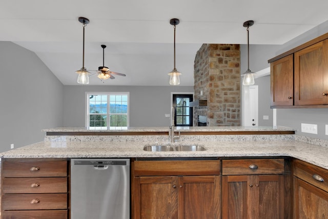 kitchen featuring ceiling fan, dishwasher, sink, pendant lighting, and lofted ceiling