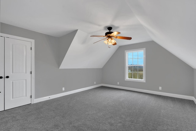 additional living space with carpet, ceiling fan, and vaulted ceiling